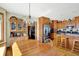 Well-lit kitchen and dining area with stainless steel appliances, hardwood floors and ample space at 1852 Lakeside Ln, Indianapolis, IN 46229