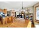 Open-concept kitchen and dining area with modern appliances and hardwood floors at 1852 Lakeside Ln, Indianapolis, IN 46229