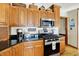 Well-organized kitchen with stainless steel appliances, granite countertops and wooden cabinets at 1852 Lakeside Ln, Indianapolis, IN 46229