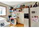 Spacious laundry room with lots of storage with wood floors and open shelving at 1852 Lakeside Ln, Indianapolis, IN 46229