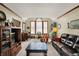 Bright and airy living room with large windows, plush carpeting, and neutral color palette at 1852 Lakeside Ln, Indianapolis, IN 46229