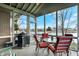 Inviting screened porch with water view, offering a relaxing outdoor living space at 1852 Lakeside Ln, Indianapolis, IN 46229