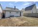 This is a backyard featuring a patch of grass with a detached garage at 2014 Barth Ave, Indianapolis, IN 46203