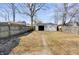 Fenced backyard with detached garage, offering privacy and plenty of room for recreation and outdoor activities at 2014 Barth Ave, Indianapolis, IN 46203