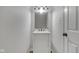 Clean bathroom featuring a marble countertop vanity and modern fixtures at 2014 Barth Ave, Indianapolis, IN 46203