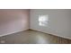 Bright bedroom showcasing hardwood floors, natural light, and neutral walls at 2014 Barth Ave, Indianapolis, IN 46203