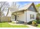 Charming single-Gathering home featuring a quaint front porch and well-maintained landscaping at 2014 Barth Ave, Indianapolis, IN 46203