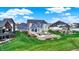 Lawn and outdoor living areas including a stone patio with a firepit and a hot tub at 20451 Chatham Hills Blvd, Westfield, IN 46074