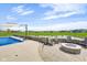 Beautiful backyard with a pool, fire pit, and view of the lake at 20451 Chatham Hills Blvd, Westfield, IN 46074