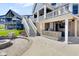 Backyard patio has an outdoor kitchen, stairs to the upper deck, and a stylish stone firepit at 20451 Chatham Hills Blvd, Westfield, IN 46074