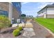 Backyard with landscape stone stairs, vibrant green lawn, and house exterior at 20451 Chatham Hills Blvd, Westfield, IN 46074