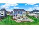Backyard patio, fire pit, and outdoor living area in lush green setting at 20451 Chatham Hills Blvd, Westfield, IN 46074