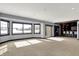 This open basement showcases large windows and bar with seating creates a welcoming space at 20451 Chatham Hills Blvd, Westfield, IN 46074