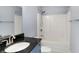 This bathroom features a tub with a shower and a black granite countertop vanity at 20451 Chatham Hills Blvd, Westfield, IN 46074