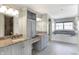 Bright bathroom featuring double sinks, granite countertops, grey cabinetry, a bathtub and shower at 20451 Chatham Hills Blvd, Westfield, IN 46074