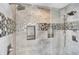 Modern tiled shower featuring dual shower heads and built-in shower niches at 20451 Chatham Hills Blvd, Westfield, IN 46074