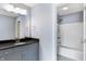 Modern bathroom featuring a vanity with a dark countertop and a shower-tub combination at 20451 Chatham Hills Blvd, Westfield, IN 46074