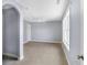 Bedroom featuring an arched entranceway, carpeted floors, and a large window with natural light at 20451 Chatham Hills Blvd, Westfield, IN 46074