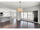 Spacious dining area connects seamlessly to the kitchen and living room, featuring wood floors at 20451 Chatham Hills Blvd, Westfield, IN 46074