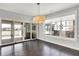 Dining space with hardwood floors, sliding glass doors to a deck, and plenty of natural light at 20451 Chatham Hills Blvd, Westfield, IN 46074