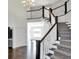 Elegant foyer showcasing a grand staircase and hardwood floors at 20451 Chatham Hills Blvd, Westfield, IN 46074