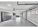 Spacious garage with epoxy flooring, ample storage cabinets, and a convenient side entrance at 20451 Chatham Hills Blvd, Westfield, IN 46074