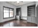 Spacious office featuring custom built-in bookshelves, cabinets, and a large window at 20451 Chatham Hills Blvd, Westfield, IN 46074