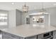 Bright kitchen island featuring quartz countertop, stainless steel appliances, and stylish pendant lighting at 20451 Chatham Hills Blvd, Westfield, IN 46074