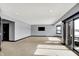 Spacious living room featuring neutral walls, recessed lighting, and sliding doors to an outdoor area at 20451 Chatham Hills Blvd, Westfield, IN 46074