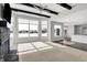 Bright living room with stone fireplace and large windows offering natural light at 20451 Chatham Hills Blvd, Westfield, IN 46074