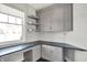 Bright home office with custom built-ins, a large window, and a sleek workspace at 20451 Chatham Hills Blvd, Westfield, IN 46074