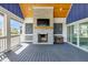 Inviting outdoor fireplace with a stone surround and views of the landscaped backyard at 20451 Chatham Hills Blvd, Westfield, IN 46074