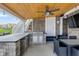Outdoor kitchen area with a built-in grill, countertop, and space for dining at 20451 Chatham Hills Blvd, Westfield, IN 46074