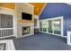 Relaxing outdoor patio boasts a stone fireplace and wood-burning fireplace, creating a cozy retreat at 20451 Chatham Hills Blvd, Westfield, IN 46074