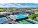 Stunning aerial view of the community pool and clubhouse surrounded by lush landscaping and tennis courts at 20451 Chatham Hills Blvd, Westfield, IN 46074