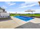 Sparkling backyard pool with a relaxing hot tub and a view at 20451 Chatham Hills Blvd, Westfield, IN 46074