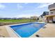Inviting backyard pool with picturesque views, an umbrella, and a basketball hoop at 20451 Chatham Hills Blvd, Westfield, IN 46074