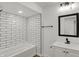 Modern bathroom features tiled shower, a sleek mirror and vanity, and modern fixtures at 2137 Napoleon St, Indianapolis, IN 46203