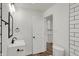 Stylized bathroom features modern fixtures, a contrasting mirror, and tile work at 2137 Napoleon St, Indianapolis, IN 46203