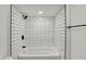 Modern bathroom boasts a tiled shower, contrasting fixtures, and recessed lighting at 2137 Napoleon St, Indianapolis, IN 46203
