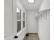 This walk-in closet has carpeted floors, two windows, and a hanging rack at 2137 Napoleon St, Indianapolis, IN 46203