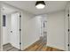 Hallway with modern floors connecting the rooms within the house at 2137 Napoleon St, Indianapolis, IN 46203