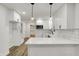 This kitchen features white cabinets, quartz counters, subway tile, and stainless steel appliances at 2137 Napoleon St, Indianapolis, IN 46203