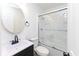 Bathroom featuring a modern vanity and shower with sliding glass door at 2306 Finley Ave, Indianapolis, IN 46203