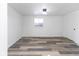 Bright bedroom featuring wood-look flooring, a ceiling fan, and a large window at 2306 Finley Ave, Indianapolis, IN 46203