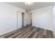 Comfortable bedroom with modern flooring, a closet, and a large window at 2306 Finley Ave, Indianapolis, IN 46203