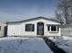 Charming one story house with a secure front door and clean white siding at 2306 Finley Ave, Indianapolis, IN 46203