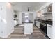 Modern kitchen with stainless steel appliances, central island, and stylish backsplash at 2306 Finley Ave, Indianapolis, IN 46203