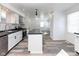 Updated kitchen featuring white cabinets, stainless steel appliances, and a kitchen island at 2306 Finley Ave, Indianapolis, IN 46203