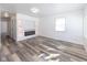 Bright living room featuring modern flooring, recessed lighting, and a decorative fireplace at 2306 Finley Ave, Indianapolis, IN 46203